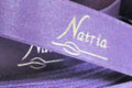 Атласная лента фирменная подарочная для туристической компании Natria. Атласная лента с печатью, ширина 20 мм,  номер ленты 130, нанесение - логотип компании Natria, тиснение серебристой фольгой, город Киев